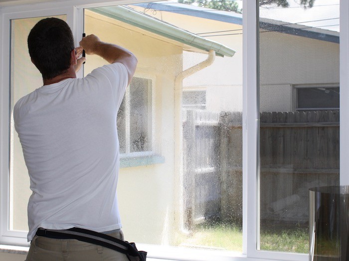 Man cleaning windows